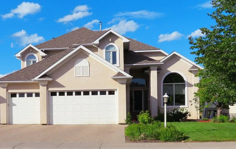 Detached home with a landscaped exterior